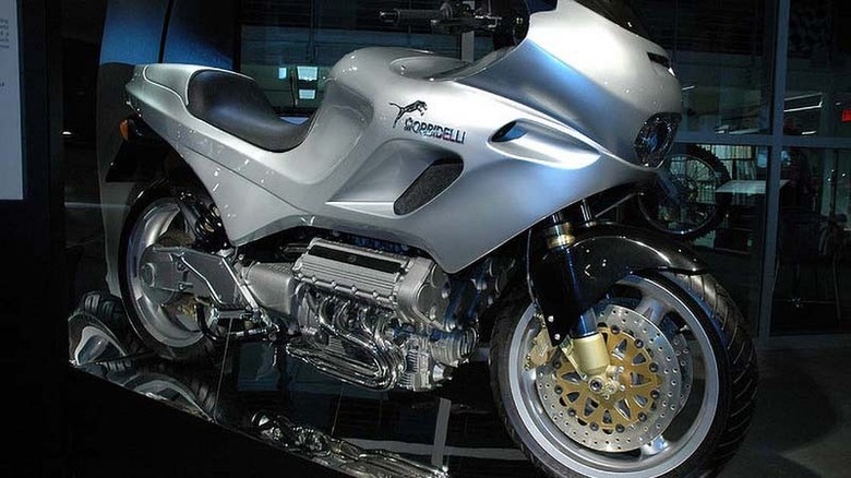 Silver Morbidelli V8 motorcycle on display stand at Barber Motorsports museum