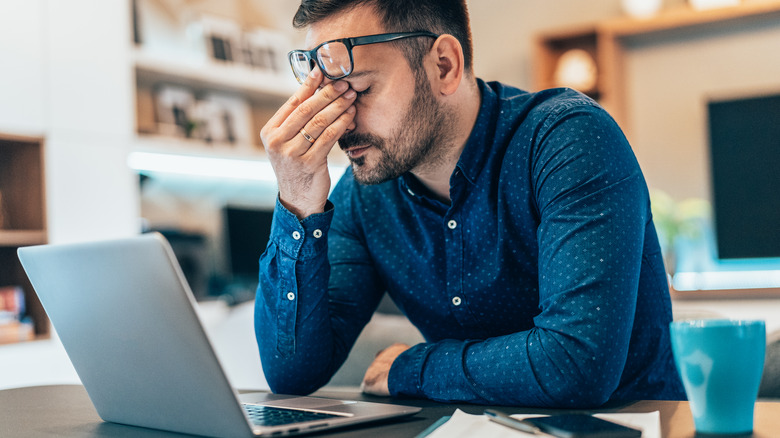 man in front of laptop