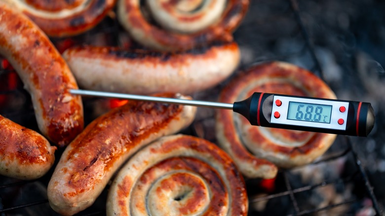 digital thermometer with meat background