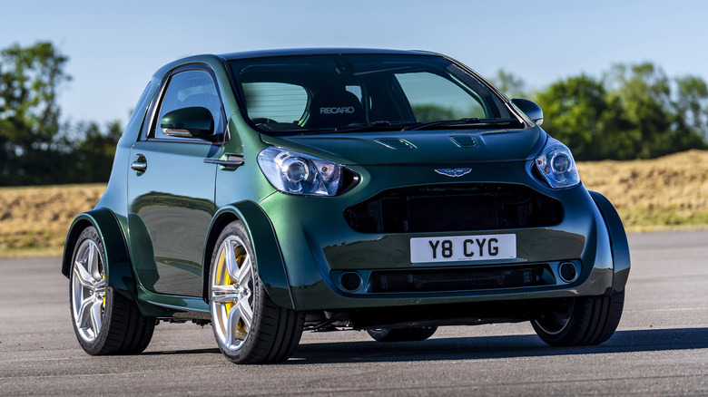 green Aston Martin Cygnet V8 on the road