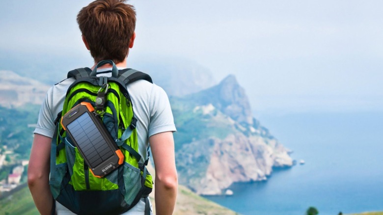 Solar power bank attached to backpack