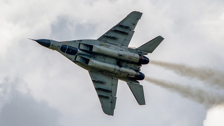 MiG-29 Fulcrum flying among clouds