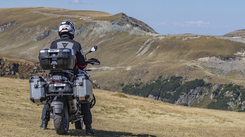 overlanding motorcycle near mountains 