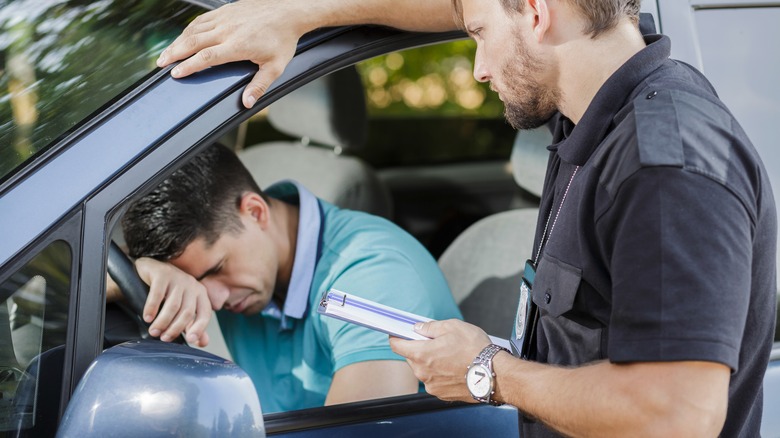 Police officer stopping driver