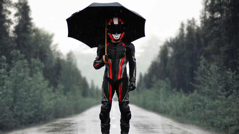 Motorcycle rider with umbrella