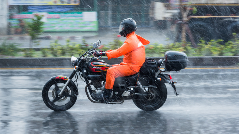 Riding motorcycle with orange suit