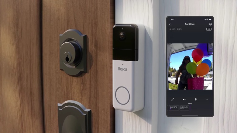 The Roku wireless doorbell next to a phone showing a live camera feed