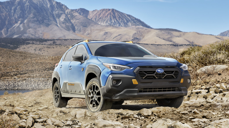 2025 Subaru Crosstrek Wilderness driving on rocky terrain