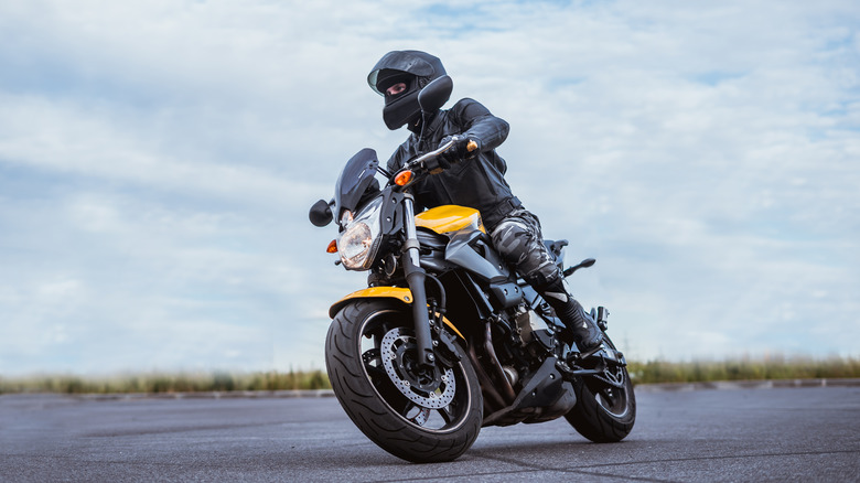 Man riding motorcycle with helmet