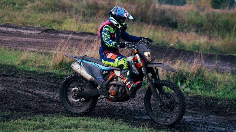 Dirt bike rider on mud