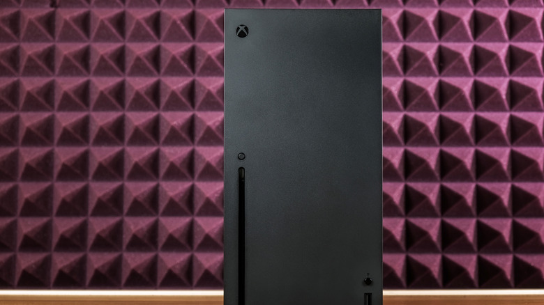 Xbox Series X console against burgundy background