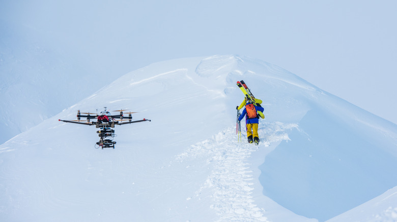 drone flying over snowy mountain