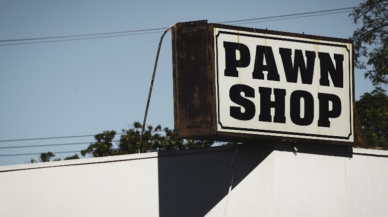 Pawn shop sign on top of building 