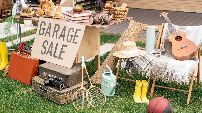 Garage sale sign with items