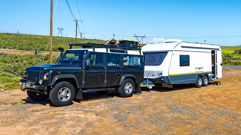 An SUV Towing A Trailer