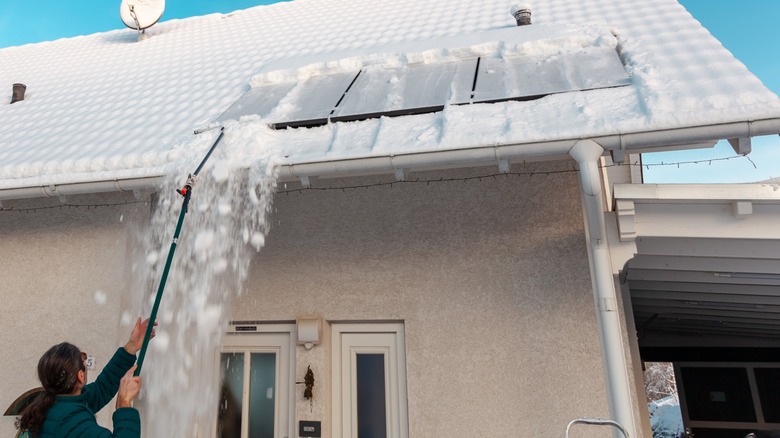 removing snow from solar panels