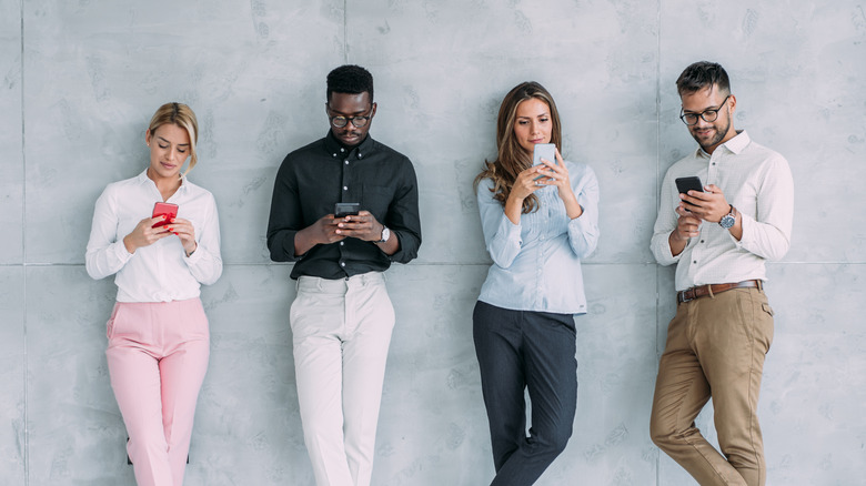 group of friends using phone