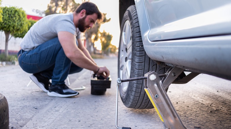 Man changing the tires