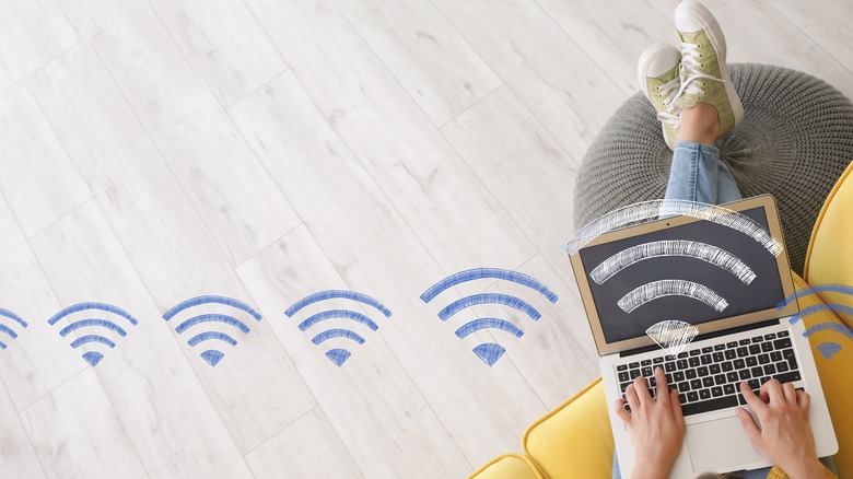 artistic rendition of Wi-Fi signal reaching a person's laptop