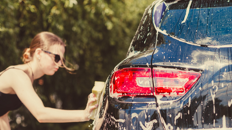 Woman washing car