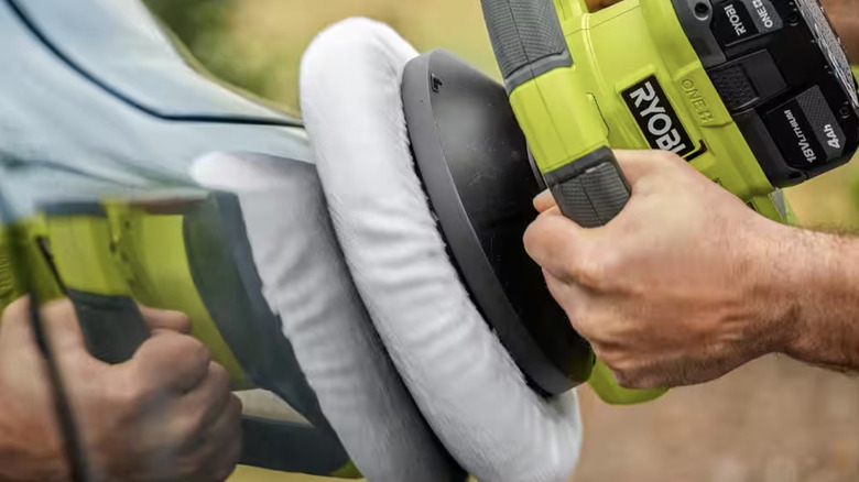 Ryobi buffer being used on car