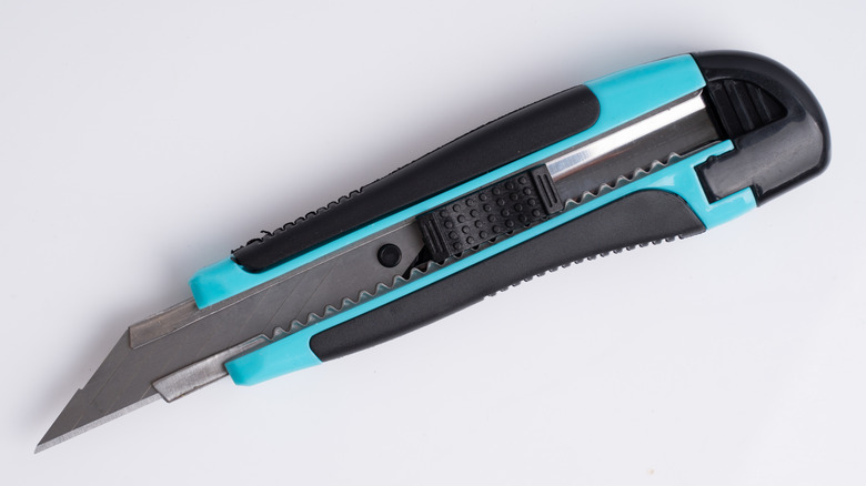 Close up of sharp utility knife extended