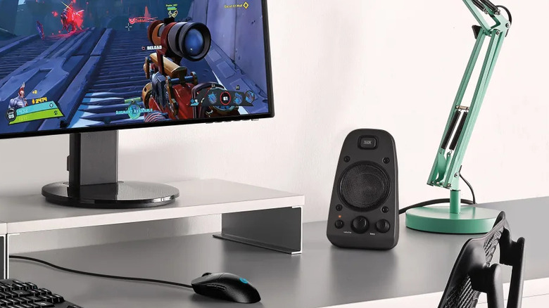 logitech pc next to monitor