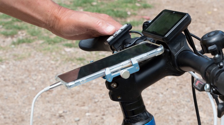 person using an ebike with phone mount