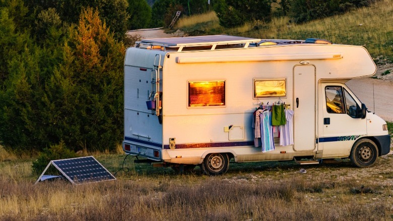 Solar panel on ground next to a RV