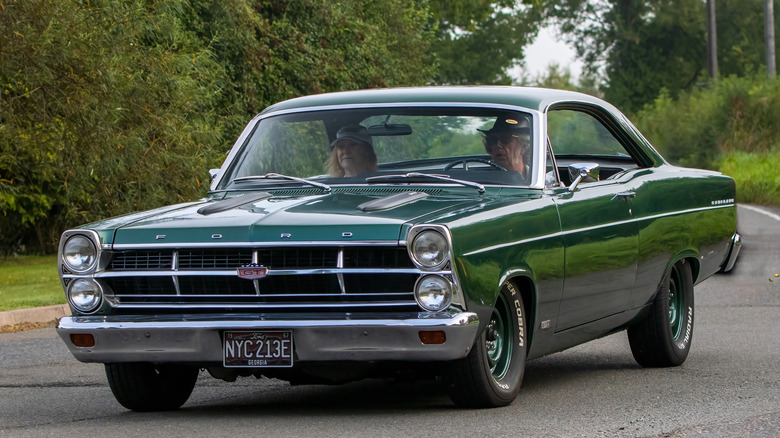 couple driving Ford Fairlane