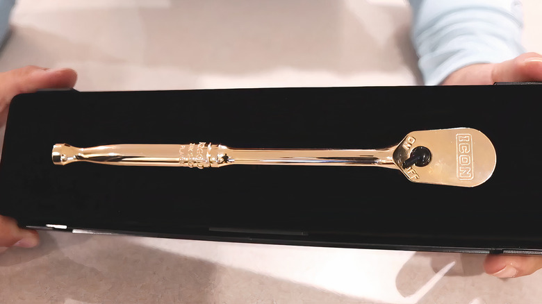 gold ratchet in black case