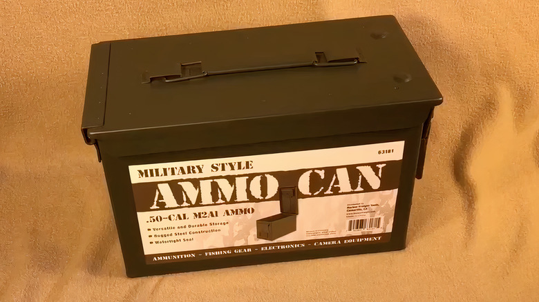 green ammo box on beige blanket