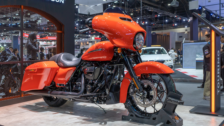 orange harley davidson street glide on display