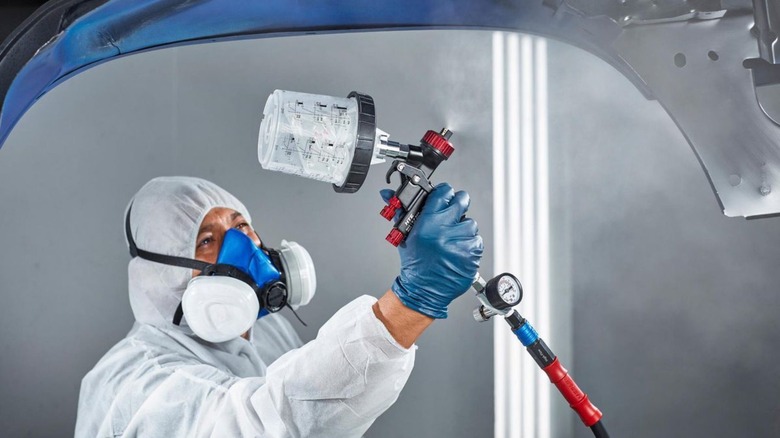 person using a paint sprayer