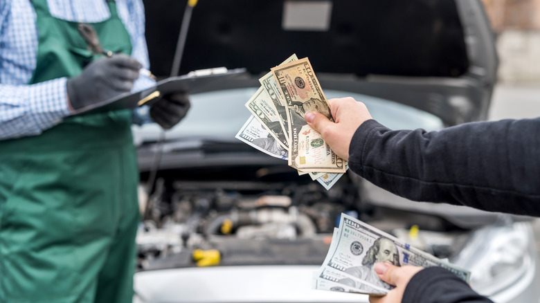 Person paying mechanic