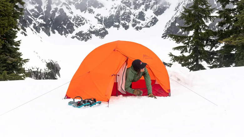 Orange tent set up in snow