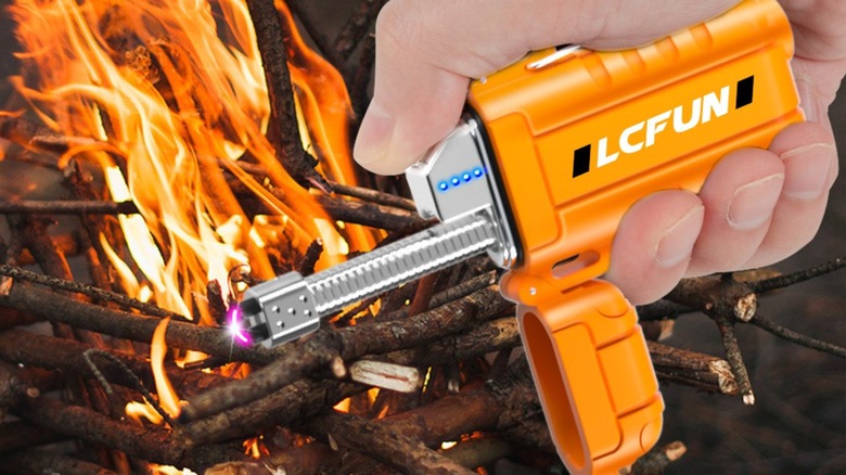 An electric lighter in front of a fire pit