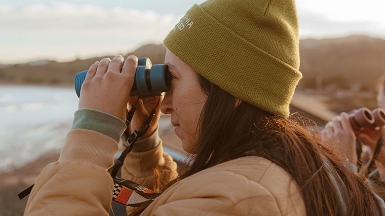 A girl using binoculars