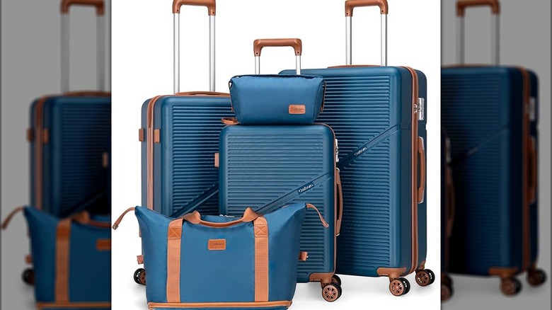 A five piece blue water resistant luggage set