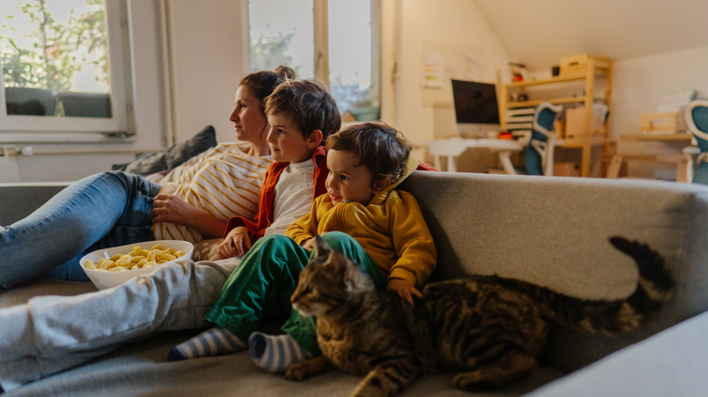 Mother and children watching TV