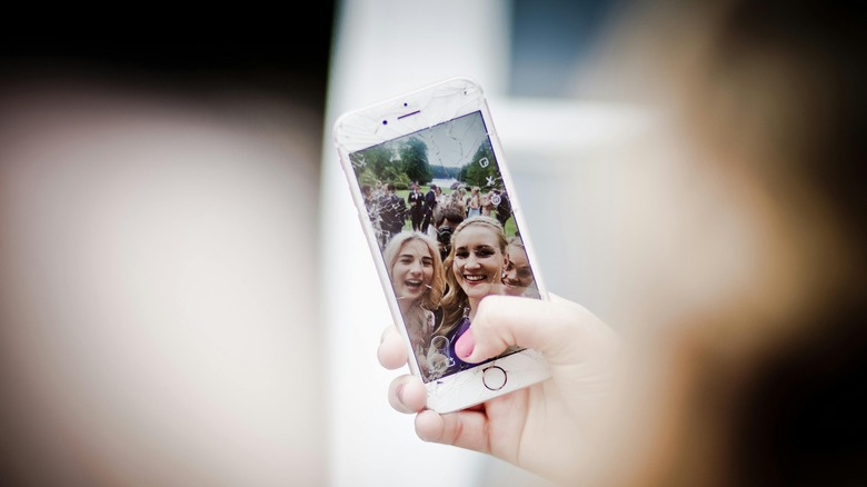 group taking a selfie on iPhone