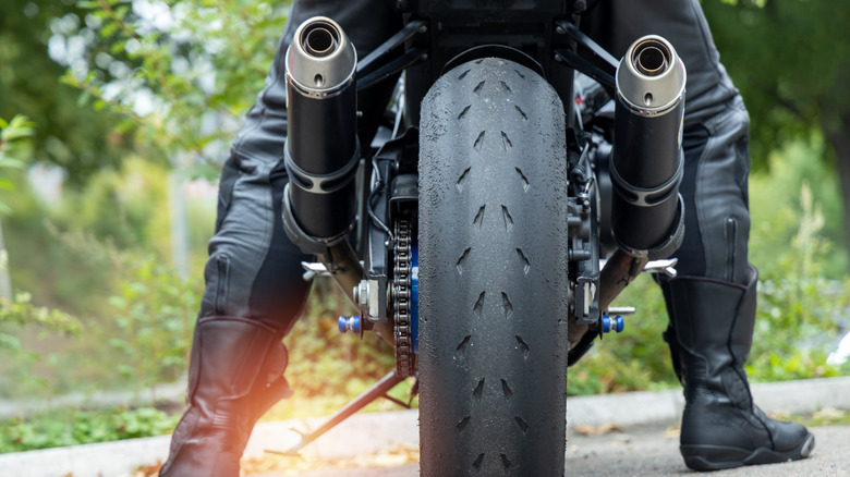 Motorcycle wheel and exhaust pipes