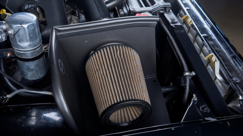 Chevy K10 truck parked showing the cold air intake box