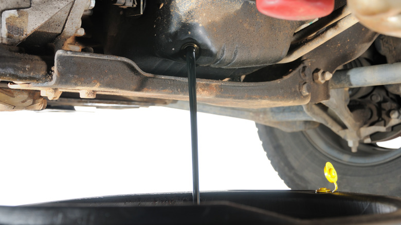 Oil draining from automotive oil pan