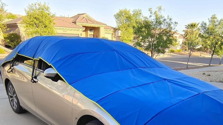 A Rapid Ready Hail Shield Applied To The Top Of A Sedan