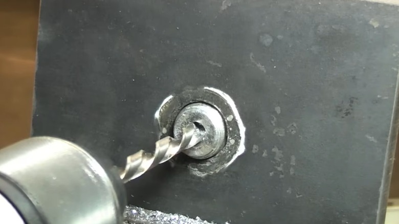 Using a left hand drill bit to remove a broken bolt