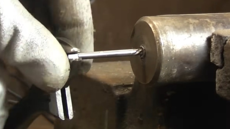 Using an extractor tool to remove a broken bolt