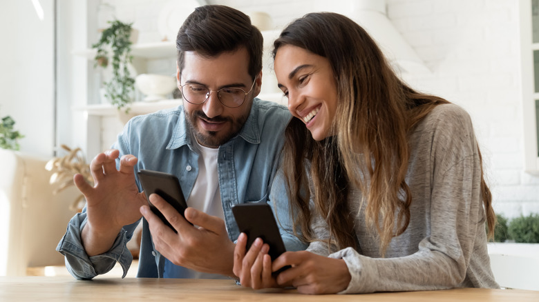 A couple with their smartphones