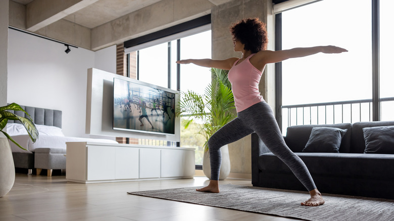 Woman following fitness video