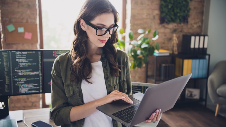 Woman using MacBook computer